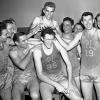 George Mikan, the 6'10" center for the Minneapolis Lakers, leads the team to the NBA title in 1950. Mikan is considered to be the NBA's first superstar.
