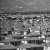 Economic prosperity in the US following World War Two continues with the demand for housing pushing rapid development of new homes and subdivisions. This neighborhood in Van Nuys, CA is one example of the post war housing boom.