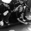 Bette Davis signing the sidewalk next to her footprints at Grauman's Chineese Theater in Hollywood.